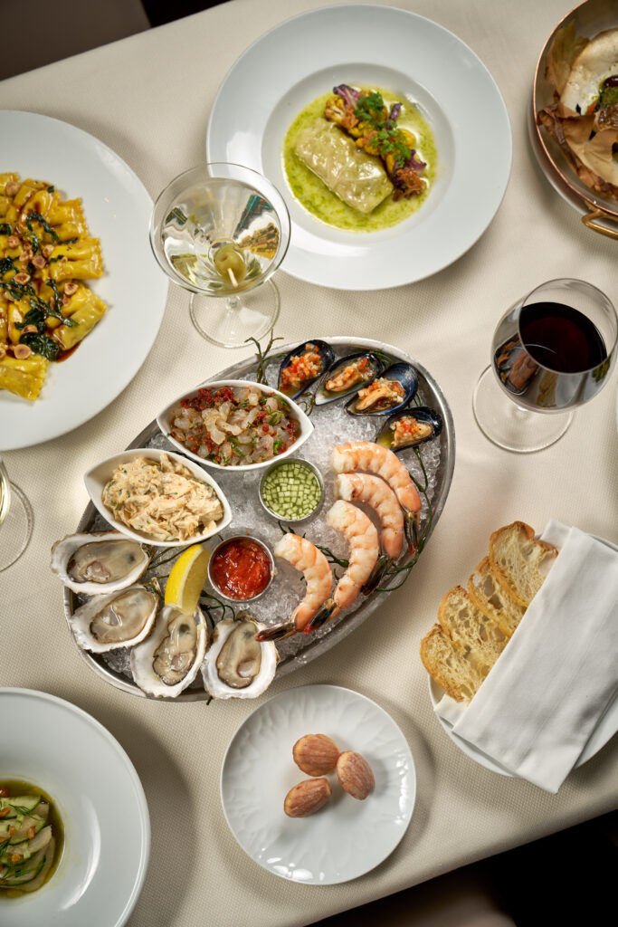 various dishes on a white table cloth.